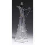 A WMF TYPE JUGENDSTIL PEWTER MOUNTED CUT GLASS  DECANTER AND STOPPER  with whiplash handle, 22cm