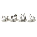 A SET OF FOUR GEORGE V SAW PIERCED SILVER BIRD AND ANIMAL MENU OR PLACE SANDS  oval base 4cm, by P C
