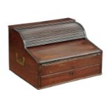 A REGENCY MAHOGANY WRITING SLOPE, C1820  with tambour shutter and fitted interior with three glass