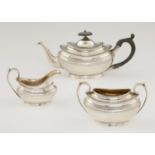 A VICTORIAN GADROONED OVAL SILVER BACHELOR'S TEA SERVICE  with engraved border and integral hinge to