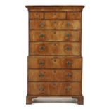A GEORGE II WALNUT CHEST ON CHEST, C1740  with stepped cavetto cornice and moulded drawers with