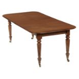 A VICTORIAN MAHOGANY DINING TABLE, C1850 with two leaves, on turned legs and brass castors, 72cm