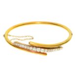 A DIAMOND AND GOLD BANGLE 6 cm w, unmarked, 13.5g Light wear consistent with age and use
