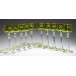A SET OF TEN BOHEMIAN HOCK GLASSES, EARLY 20TH C  the chartreuse bowl gilt with the initial H, on