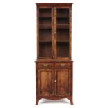 A VICTORIAN MAHOGANY BOOKCASE, C1840  with adjustable shelves enclosed by two glazed three pane
