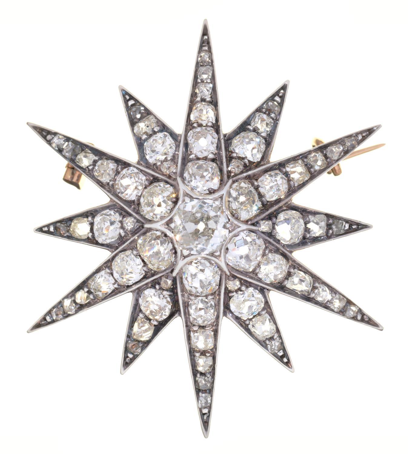 A VICTORIAN DIAMOND STAR BROOCH-PENDANT, C1880 in silver and gold, 3.7cm diam,  7.3g No apparent