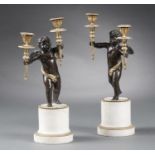 A PAIR OF FRENCH BRONZE AND MARBLE CANDELABRA, 19TH C of Putto naked save for a drapery and