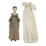 A PEG DOLL, GRODNERTAL,  19TH C with  painted cotton and white lace edged dresses Good unrestored