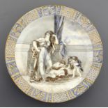 A WEDGWOOD QUEENSWARE CHARGER, 1860 OR 86 painted in the manner of Henry Brownsword with a classical