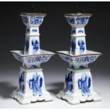 A PAIR OF CHINESE BLUE AND WHITE PRICKET CANDLESTICKS  of square section with drip pan and painted