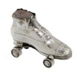 AN EDWARD VII SILVER SKATE NOVELTY PIN CUSHION  in the form of a brogue on a roller skate, 6.8cm, by