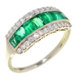 AN EMERALD AND DIAMOND RING with central row of calibre cut emeralds, in platinum, 4g, size L½
