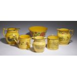 SIX BRITISH YELLOW GLAZED WARES, C1820 comprising three bat printed jugs, a silver lustre mug with