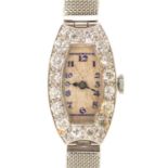 A DIAMOND  COCKTAIL WATCH, C1940 in platinum, 2.3 x 1.5cm, on mail bracelet Watch not running. hands