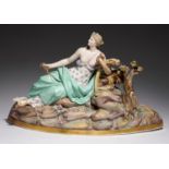 A MEISSEN FIGURE OF CERES, LATE 19TH C with sheaves of corn and reclining on rocks on gilt base,