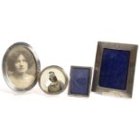 FOUR SILVER PHOTOGRAPH FRAMES, EDWARD VII AND LATER, LARGEST 17.5 X 14 CM TWO LARGER FRAMES