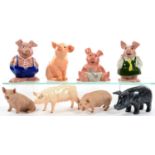 THREE WADE NATWEST PIGGY BANKS AND SEVERAL OTHER CERAMIC AND STONE PIG ORNAMENTS