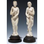 TWO EUROPEAN IVORY STATUETTES OF VENUS AND CERES, ON AFFIXED, TURNED AND STAINED EBONISED BASE, 24