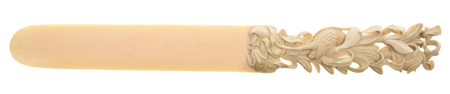 AN IVORY LETTER KNIFE, THE HANDLE CARVED WITH BIRDS AND NATURALISTIC FOLIAGE, 30CM L, LATE 19TH C