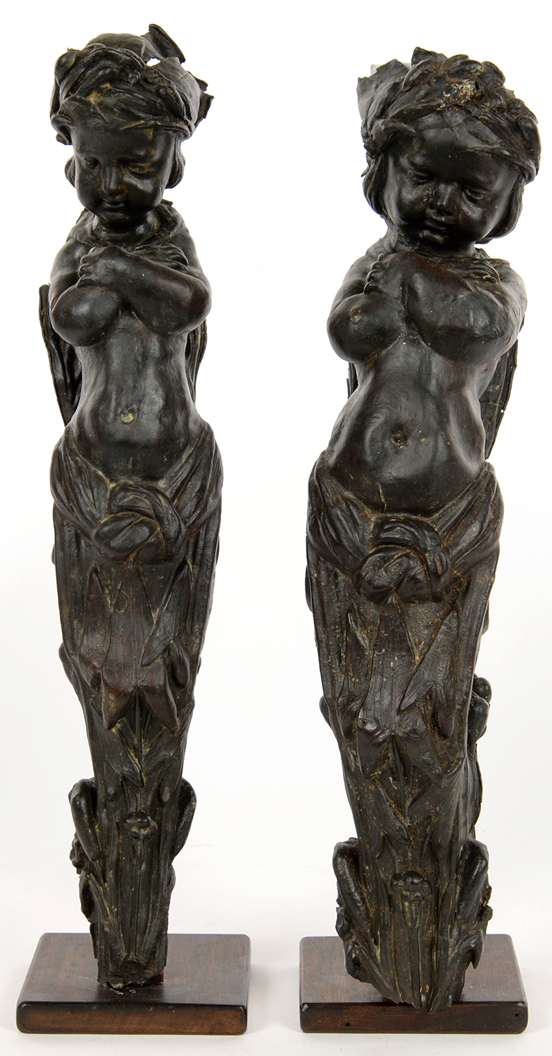 A PAIR OF EMBOSSED LEATHER DEMI FIGURE APPLIQUES, ON WOOD STANDS, 48CM H