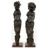A PAIR OF EMBOSSED LEATHER DEMI FIGURE APPLIQUES, ON WOOD STANDS, 48CM H