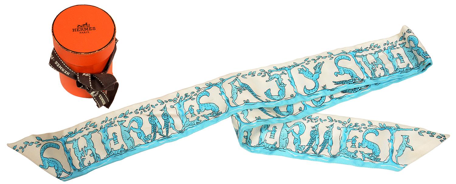 HERMÉS. 'ALPHABET' BLUE SILK TWILLY, 85 CM L, BOXED