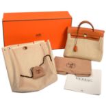 HERMES. 'HERBAG 2 IN 1', IN BEIGE CANVAS AND BROWN LEATHER,  PROTECTIVE BAG, BOX AND BROCHURE