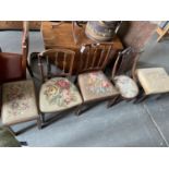 AN EDWARDIAN MAHOGANY NURSING CHAIR, TWO VICTORIAN MAHOGANY DINING CHAIRS WITH WOOLWORK SEATS, A