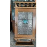 AN ART NOUVEAU STYLE OAK WALL HANGING CABINET WITH LEADED GLASS DOOR, 65CM H X 30CM W