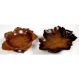 TWO SWISS MUSICAL CARVED AND STAINED  WALNUT LEAF SHAPED DISHES, 22 AND 26.5CM L, C1930