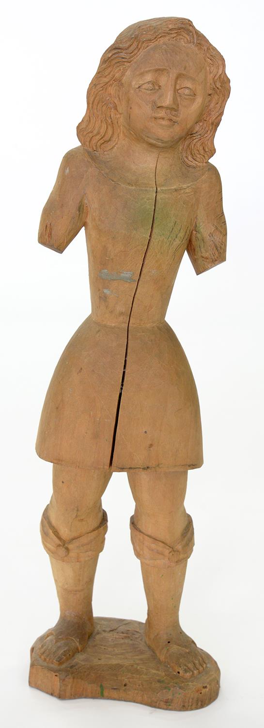 A  MEDIEVAL STYLE CARVED  SOFTWOOD FIGURE OF A BOY, 75CM  H