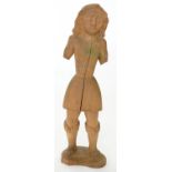 A  MEDIEVAL STYLE CARVED  SOFTWOOD FIGURE OF A BOY, 75CM  H