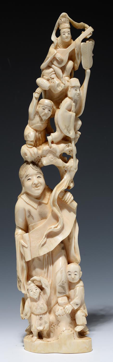 A JAPANESE IVORY OKIMONO OF IMMORTALS, 35.5CM H, MEIJI PERIOD