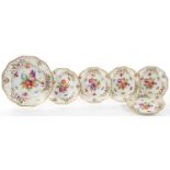 A SET OF SIX GERMAN RETICULATED PLATES, PAINTED WITH FLOWERS, ONE 26CM DIAM, THE OTHERS 19CM,