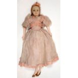 A 1930'S PADDED CLOTH BOUDOIR DOLL WITH PAINTED WOOD FORELIMBS