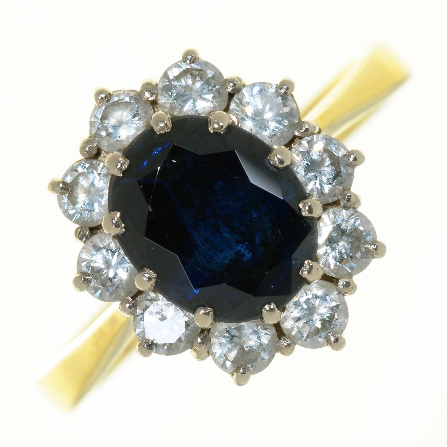 A SAPPHIRE AND DIAMOND CLUSTER RING IN 18CT GOLD, LONDON 1986, 6G, SIZE Q NO DAMAGE TO STONES. BUILD