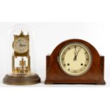 A BRASS ANNIVERSARY CLOCK WITH GLASS DOME AND A WALNUT MANTEL CLOCK, 22CM H
