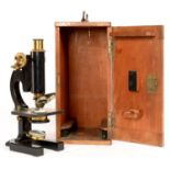 AN EARLY 20TH CENTURY LACQUERED AND BLACKED BRASS COMPOUND MICROSCOPE BY R 7 J BECK LTD, LONDON,
