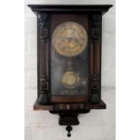 A GERMAN CARVED AND STAINED WALL CLOCK WITH GRIDIRON PENDULUM, 55CM H, C1900