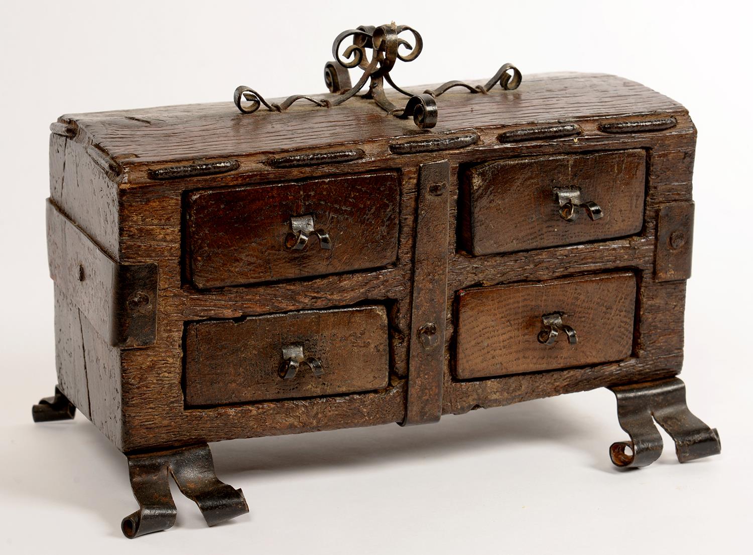 MINIATURE FURNITURE.  A 16TH C STYLE OAK AND WROUGHT IRON CHEST, ON SCROLL FEET, 24CM L