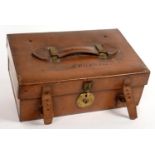 A CANVAS LINED TAN LEATHER CASE, THE LID INSCRIBED A F G ELLIS, HANDLE STAMPED 2391, 35CM L, TRADE