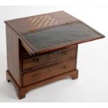 MINIATURE FURNITURE.  A GEORGE III STYLE MAHOGANY BACHELOR'S CHEST. THE FOLDOVER TOP REVEALING