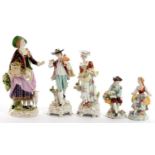 A GERMAN PORCELAIN FIGURE OF A SHEPERDESS AND TWO  PAIRS OF SIMILAR SMALLER SITZENDORF PORCELAIN
