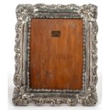 A PERUVIAN SILVER MOUNTED WOODEN PHOTOGRAPH FRAME, 32 X 26 CM, MARKED 925 SLIGHT DENTED WITH SOME