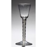 AN ENGLISH WINE GLASS, C1765, THE BELL BOWL ON DOUBLE SERIES OPAQUE TWIST STEM AND CONICAL FOOT,