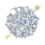 A DIAMOND CLUSTER RING IN WHITE GOLD, MARKED 18CT, 5.8G, SIZE M NO DAMAGE TO STONES. LIGHT SURFACE