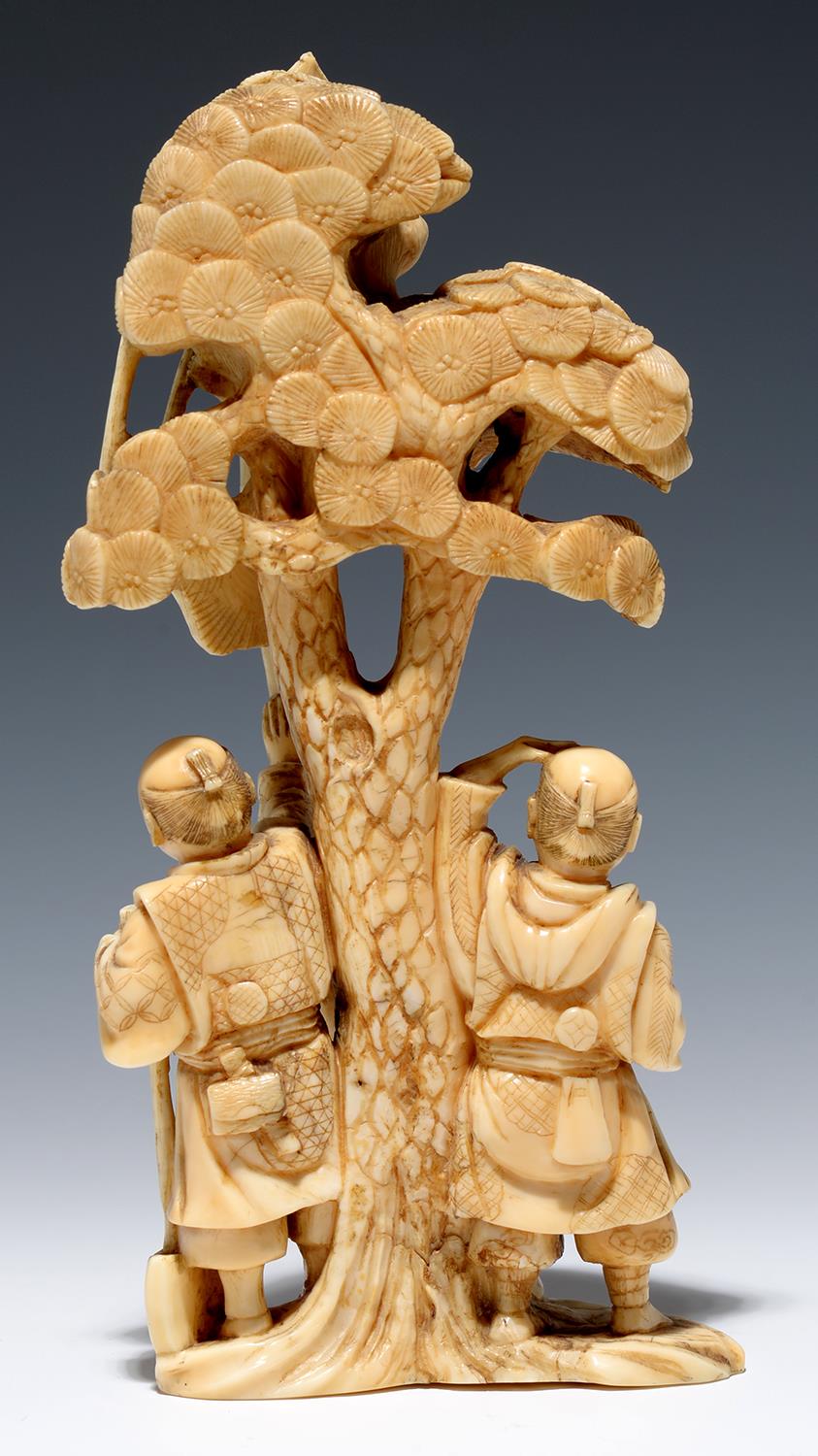 A JAPANESE IVORY OKIMONO OF A WOODCUTTER AND TWO FIGURES WITH A TETHERED MONKEY ABOVE IN THE CROWN - Image 2 of 2