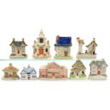 A  COLLECTION OF STAFFORDSHIRE AND REPRODUCTION STAFFORDSHIRE COTTAGES INCLUDING PASTILLE BURNERS