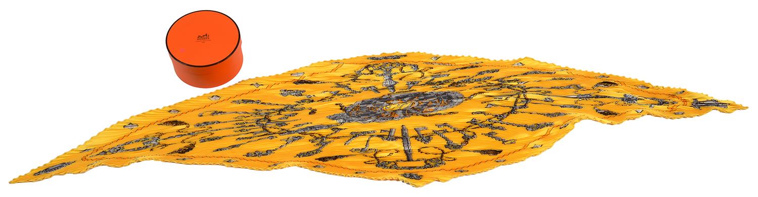 HERMÉS. YELLOW PLEATED SILK SCARF, 118 CM L, BOXED