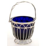 AN EDWARD VII SILVER WIREWORK SUGAR BASKET, BLUE GLASS LINER, 7 CM H, CHESTER 1910, 2OZS 12DWTS GOOD